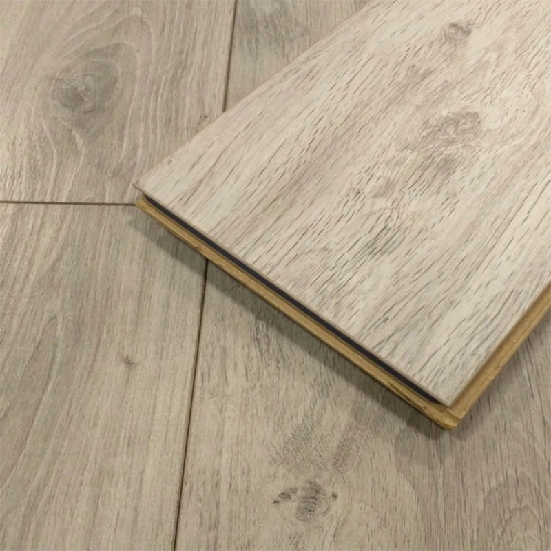 Open-plan layout using continuous 12mm dark wood laminate flooring