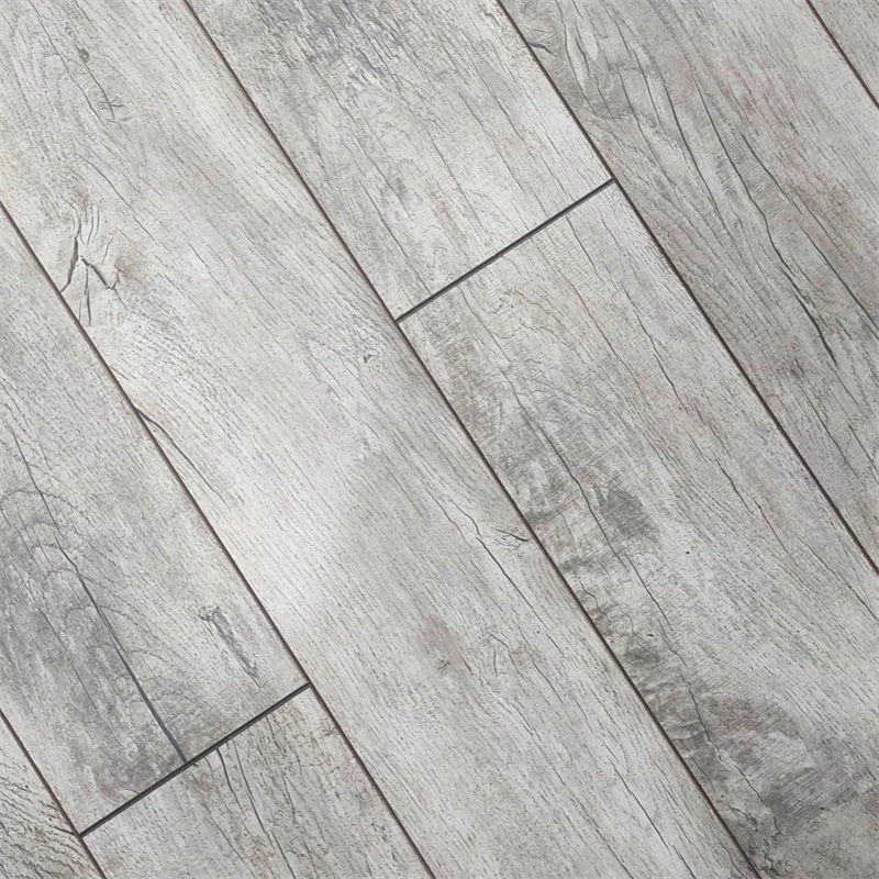 Close-up of bevelled edges and surface texture on HDF laminate flooring